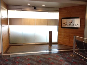 a large glass door with a sign in front of it