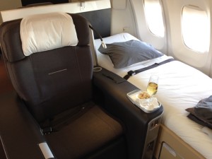 a bed and a tray in a plane