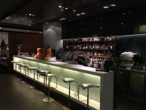 a bar with many bottles on the counter