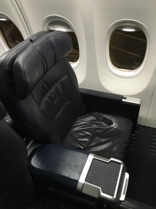 a black leather seat in an airplane